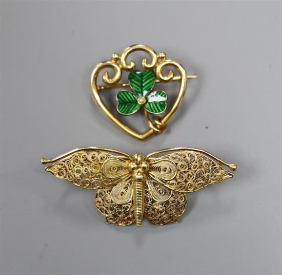 A yellow metal filigree butterfly brooch (tests as 18ct), 5.2g and a 15ct gold, enamel and pearl clover leaf openwork brooch, 4.7g
